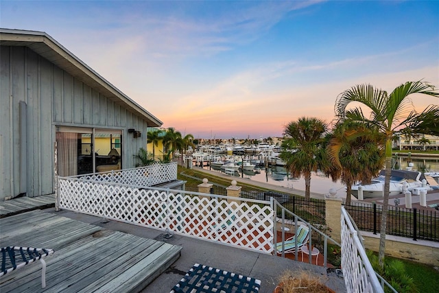 exterior space featuring a boat dock and a water view