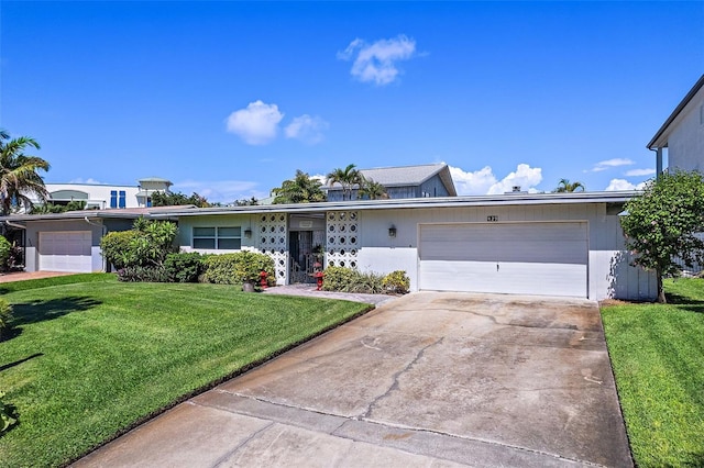 ranch-style house featuring a garage and a front yard