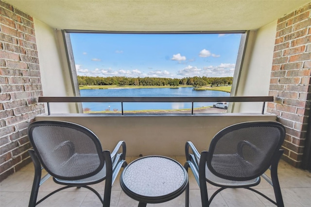 balcony featuring a water view