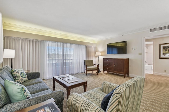 living room featuring crown molding and light colored carpet