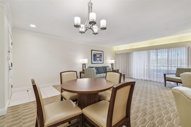 dining room featuring ornamental molding and an inviting chandelier