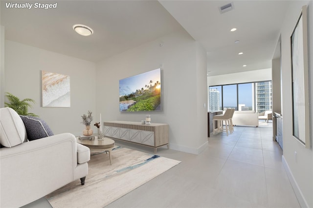 living room featuring light tile flooring