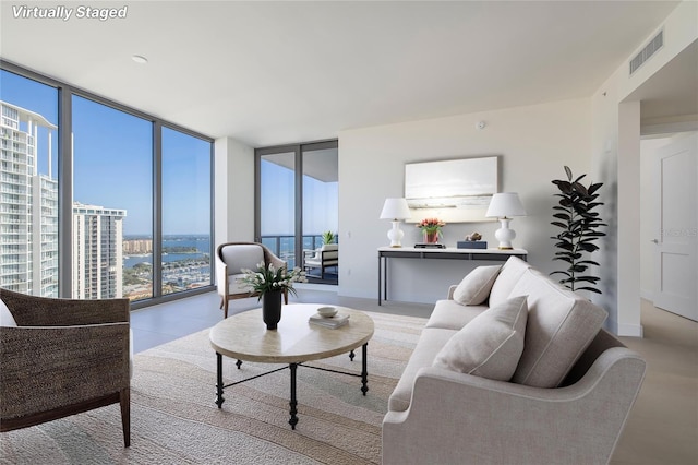 living room with expansive windows and a wealth of natural light