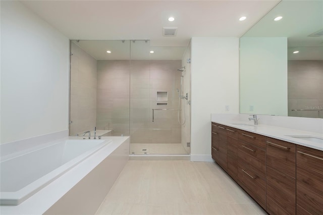 bathroom with shower with separate bathtub, double vanity, and tile flooring