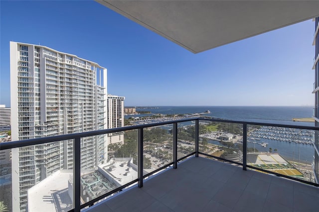 balcony featuring a water view