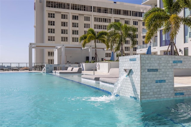 view of swimming pool featuring pool water feature