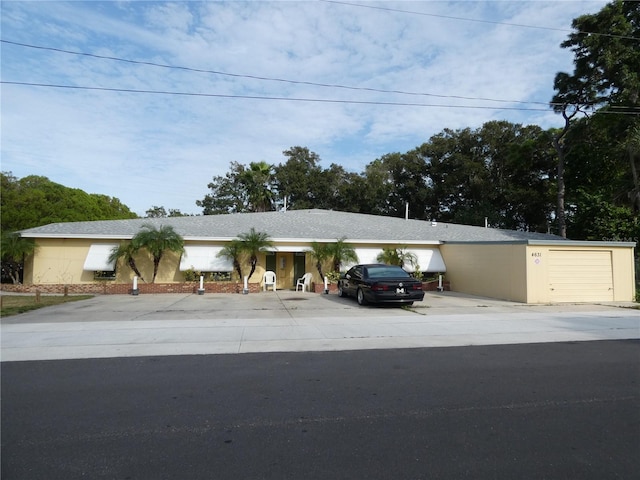 ranch-style home featuring a garage