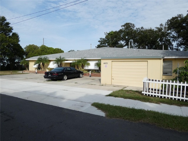 ranch-style home featuring a garage