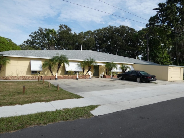 single story home with a garage