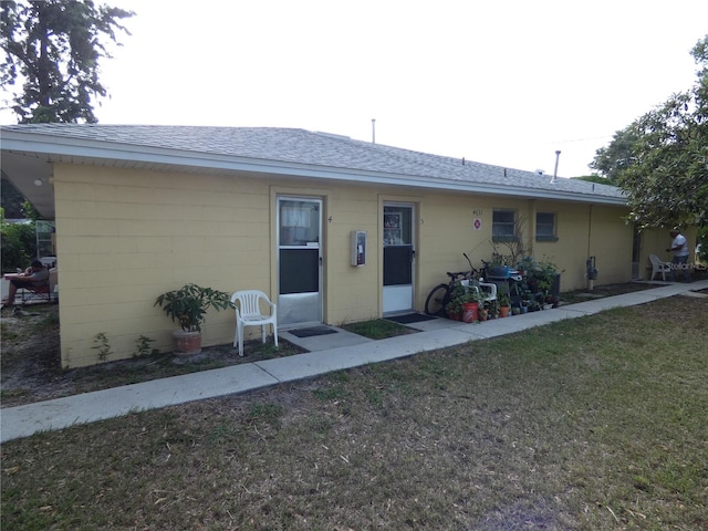 ranch-style house with a front yard