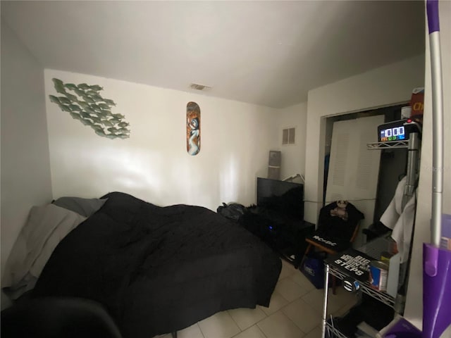 bedroom with light tile floors