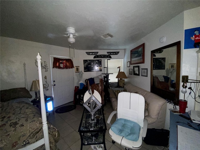 tiled bedroom with ceiling fan