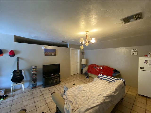 tiled bedroom with an inviting chandelier and white refrigerator