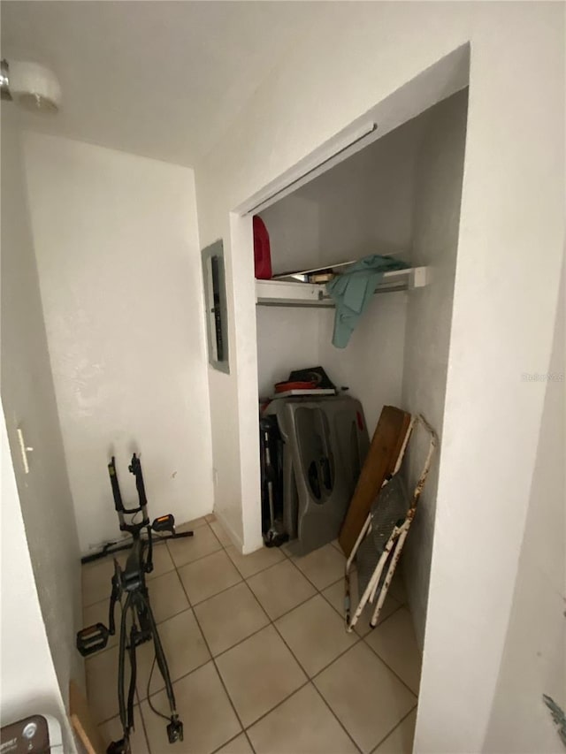 hallway featuring light tile floors