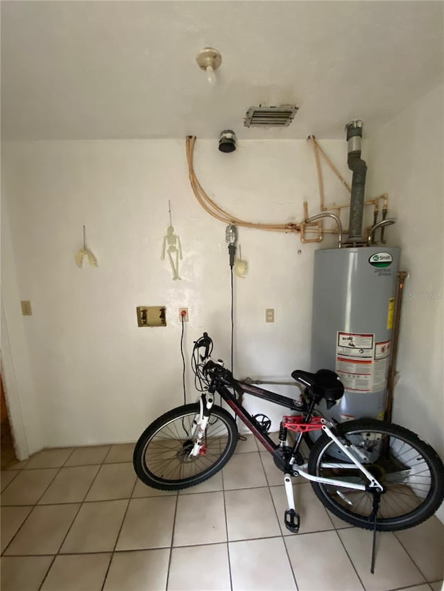 utility room featuring gas water heater