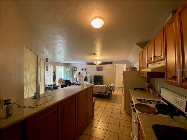 kitchen with light tile floors and gas range gas stove