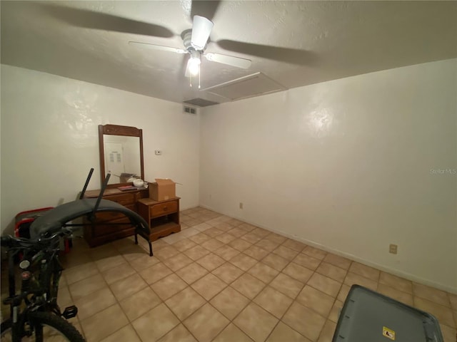 home office featuring ceiling fan and light tile flooring