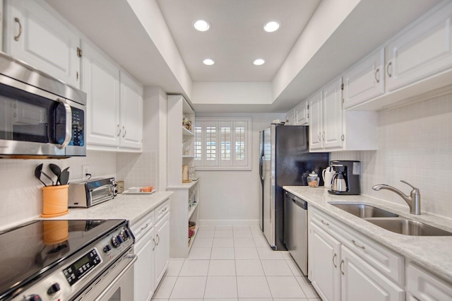 kitchen featuring stainless steel appliances and white cabinets