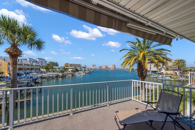 balcony featuring a water view