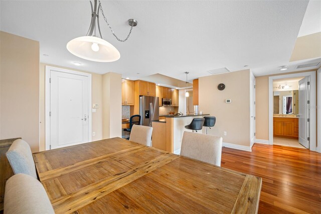 dining area featuring light hardwood / wood-style floors