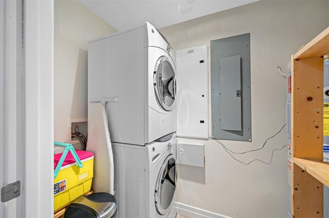 washroom featuring stacked washer and dryer and hookup for a washing machine