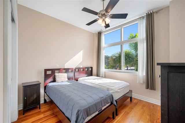 bedroom featuring ceiling fan and light hardwood / wood-style flooring