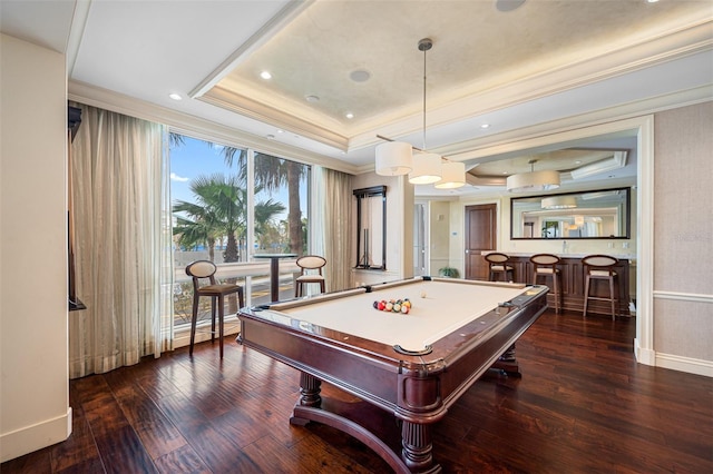 playroom featuring billiards, indoor bar, a raised ceiling, and dark wood-type flooring