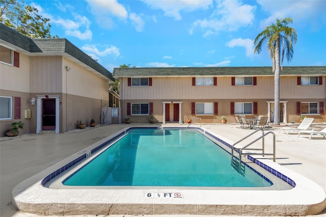 view of swimming pool with a patio