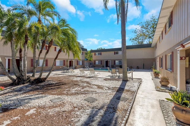 view of property's community with a pool and a patio area