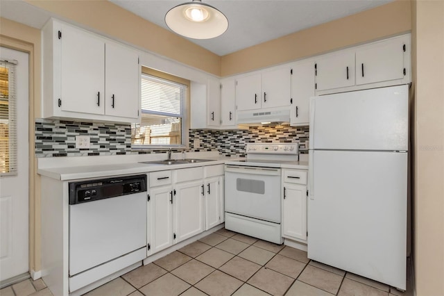 kitchen with tasteful backsplash, white appliances, sink, and white cabinets