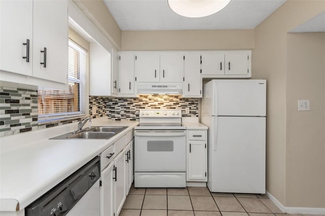 kitchen with sink, white cabinetry, light tile patterned floors, white appliances, and decorative backsplash