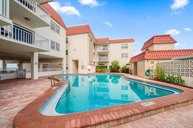 view of swimming pool with a patio