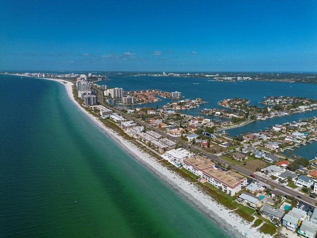 birds eye view of property with a water view and a view of the beach