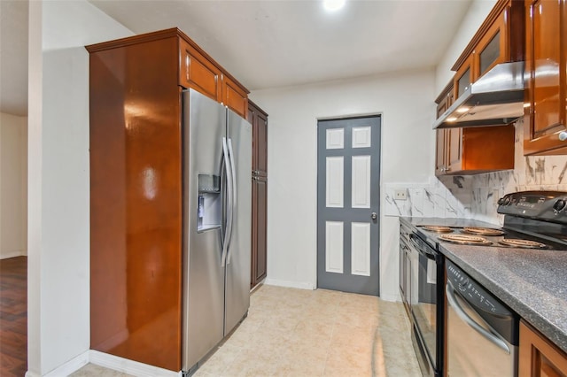 kitchen featuring wall chimney exhaust hood, decorative backsplash, and appliances with stainless steel finishes