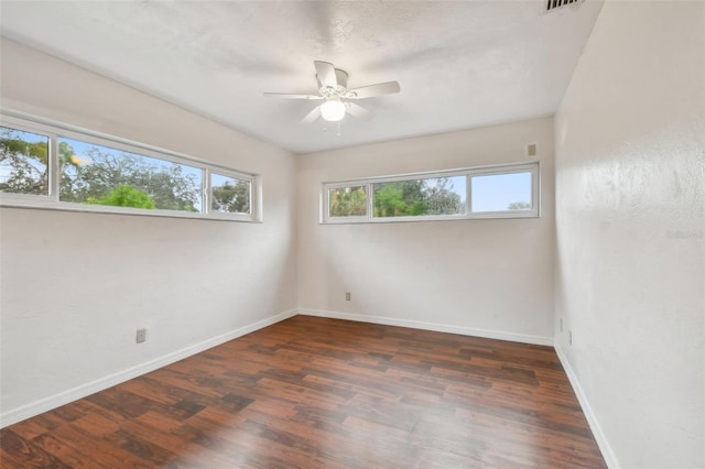 unfurnished room featuring dark hardwood / wood-style floors and ceiling fan