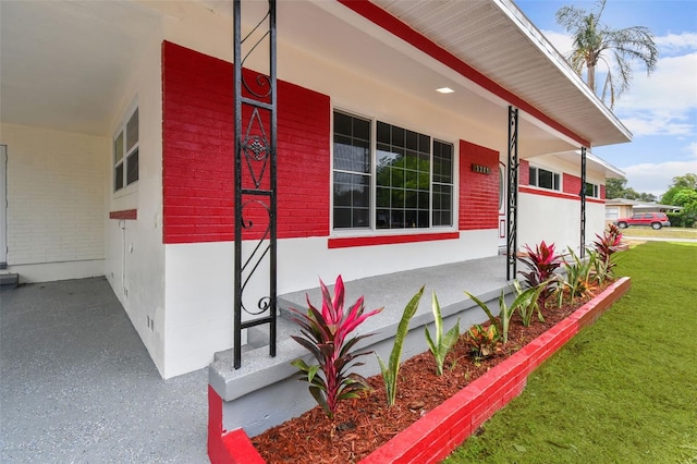 view of side of property with a porch