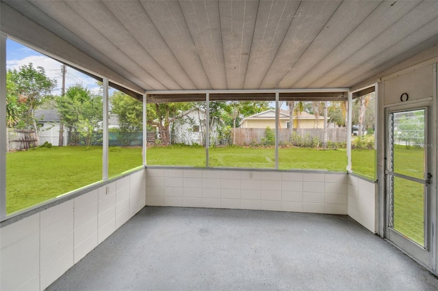 unfurnished sunroom featuring wooden ceiling