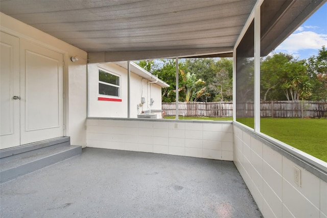 unfurnished sunroom featuring plenty of natural light