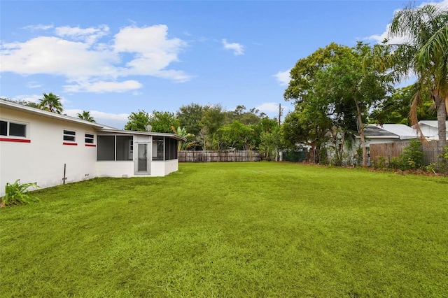 view of yard with a sunroom