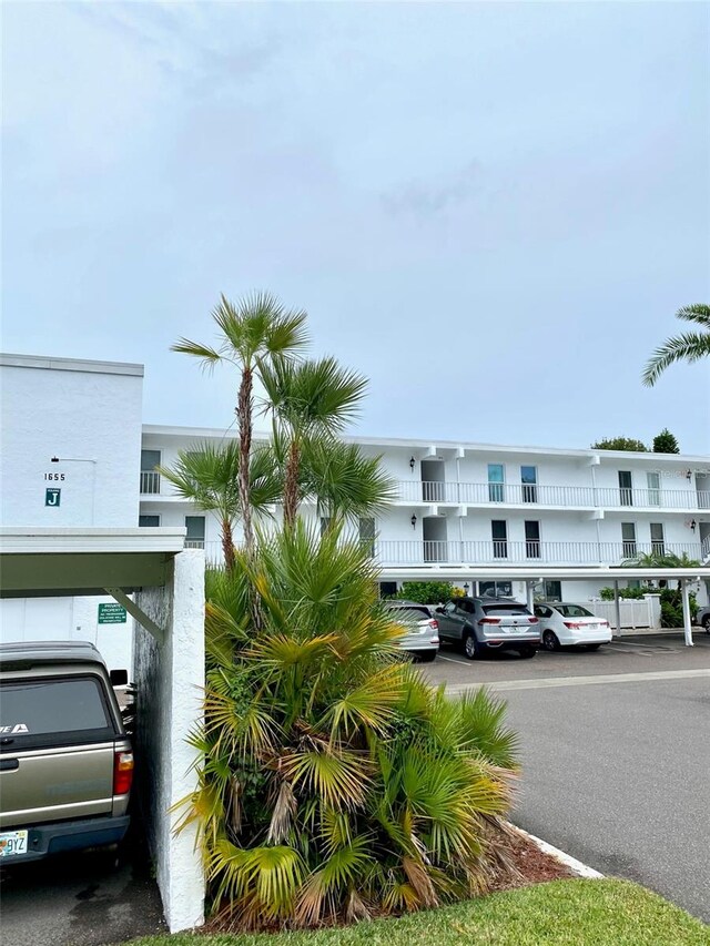 view of property with covered parking