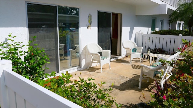 view of patio / terrace featuring fence