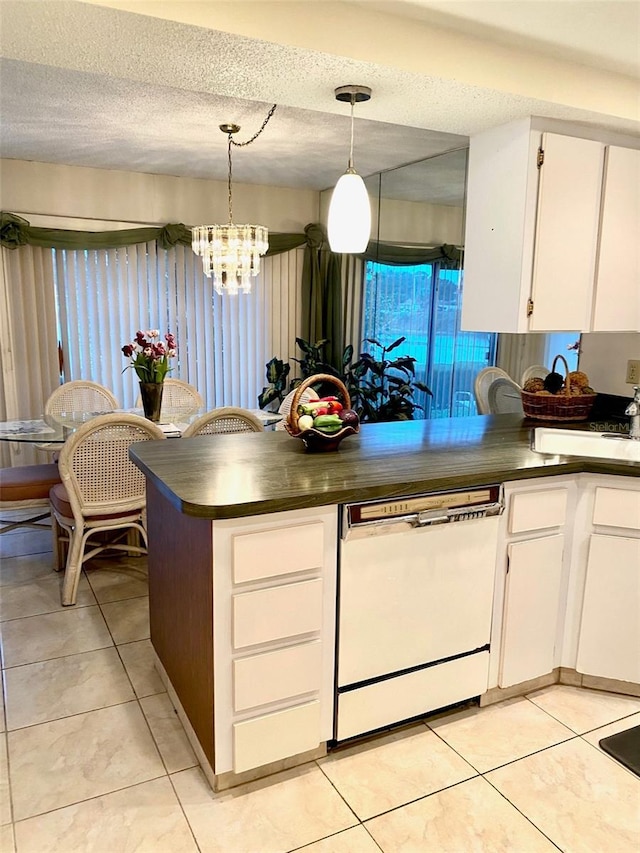 kitchen with a textured ceiling, light tile patterned flooring, white cabinets, dishwasher, and dark countertops