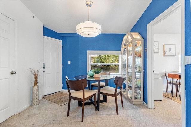 dining area with carpet floors and baseboards