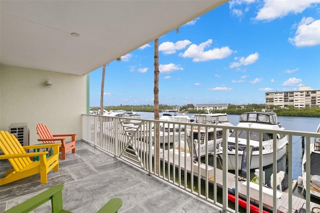 balcony featuring a water view