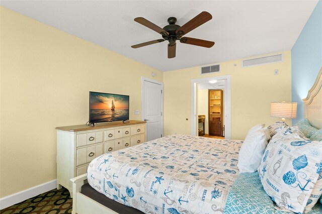 carpeted bedroom featuring ceiling fan