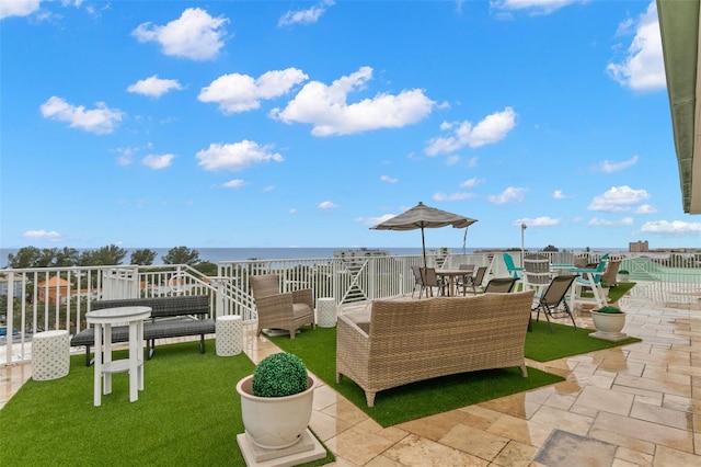 view of patio with a water view