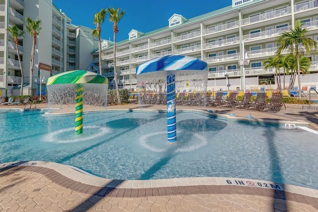 view of swimming pool featuring pool water feature