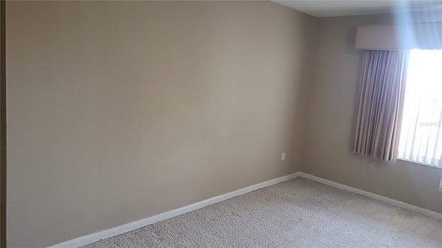 empty room featuring carpet floors