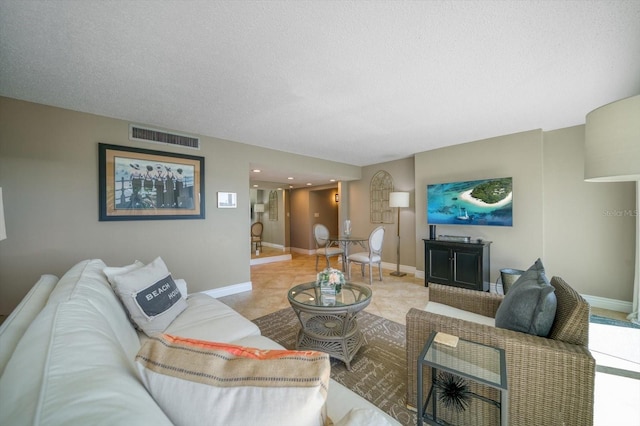 living room with a textured ceiling