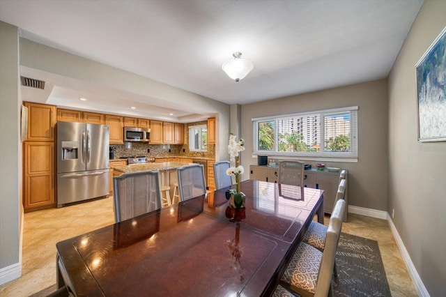 dining room with light tile patterned floors